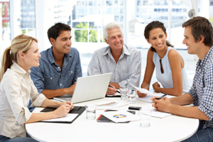 Indiana Health Insurance remains a top priority for employees image shows group of people around table