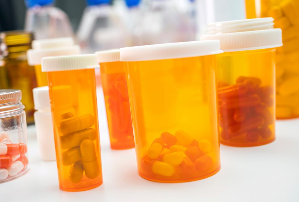 House Enrolled Act 1004 helps employers with Indiana Group Health Insurance through transparent drug prices image shows pills in bottles
