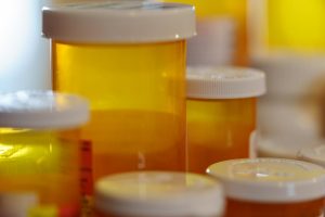 weight loss drugs are often not covered in Indiana Health Insurance plans image shows group of empty pill bottles