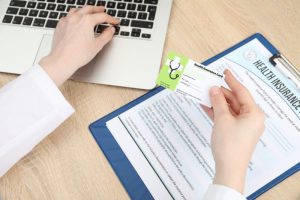 Work with Nefouse & Associates on determining Indiana Group Health Insurance options image shows doctor entering insurance information