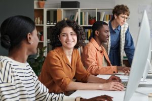 employers can consider an ICHRA for Indiana Group Health Insurance image shows employees sitting together